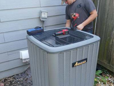 Engle Services HVAC Technician installing an AC unit in Pell City, Alabama