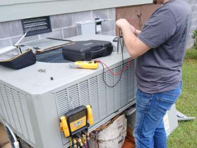 Engle Services HVAC Technician Repairing AC unit in Birmingham, Alabama